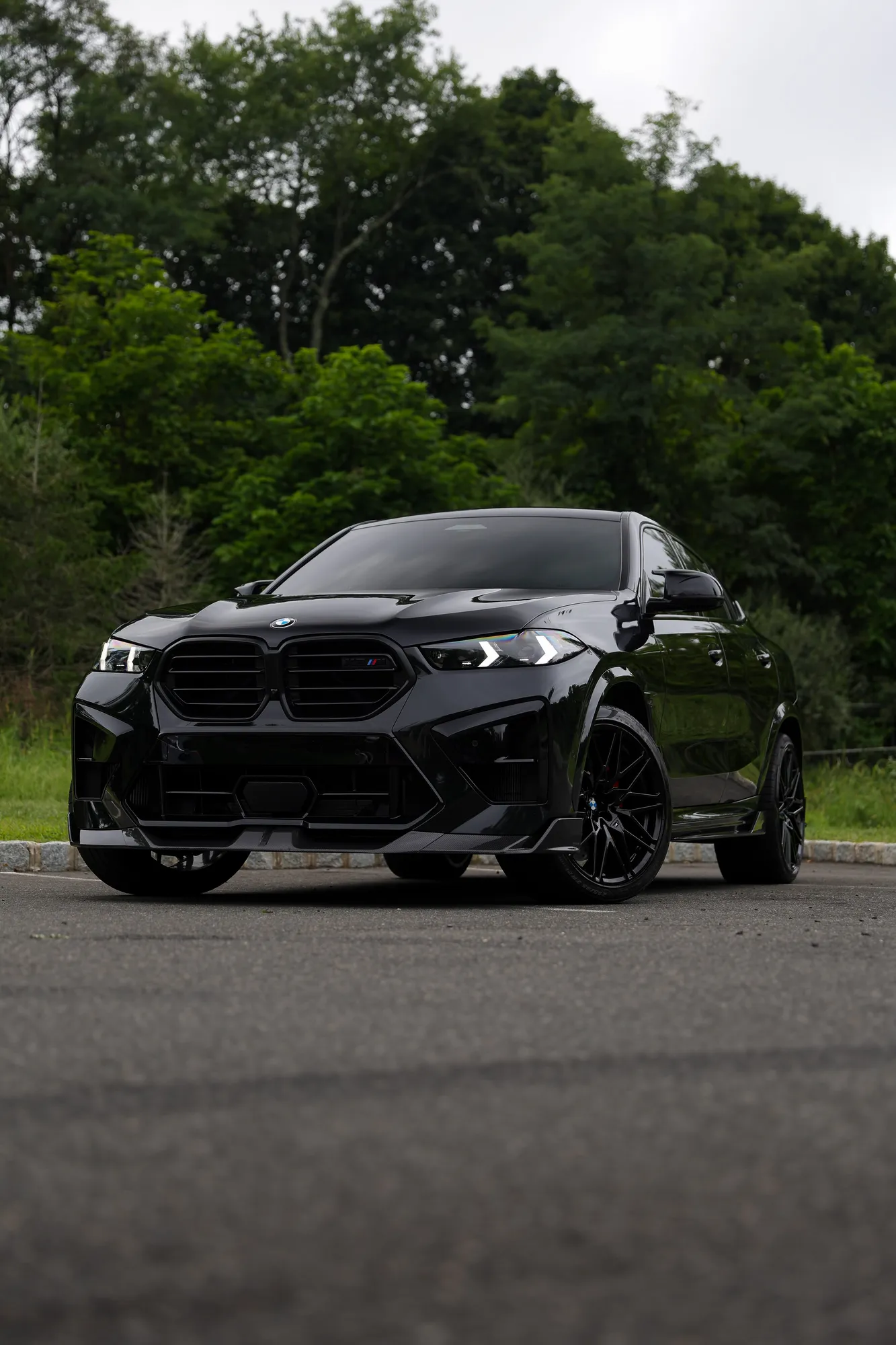 2025 BMW X6M Competition in Black Sapphire with full carbon fiber aero and Valvetronic exhaust by Lux Auto Studio, Marlboro NJ